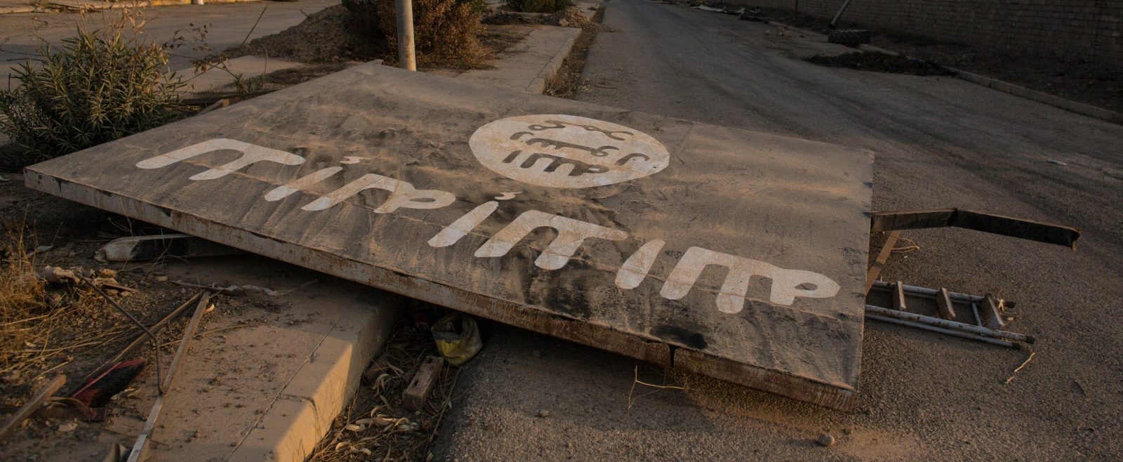 fallen billboard in Iraq